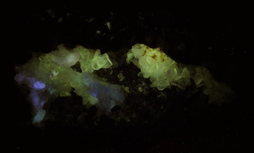 Photo below under longwave ultraviolet illumination of Cerussite and Quartz in Galena solution cavity from Wheatley Mine, Phoenixville District, Chester County, Pennsylvania Cerussite and Quartz in Galena solution cavity from Wheatley Mine, Phoenixville District, Chester County, Pennsylvania
