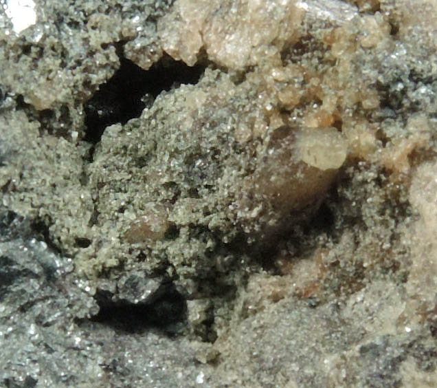 Fluorapatite and Quartz in Galena from Pea Ridge Mine, Washington County, Missouri