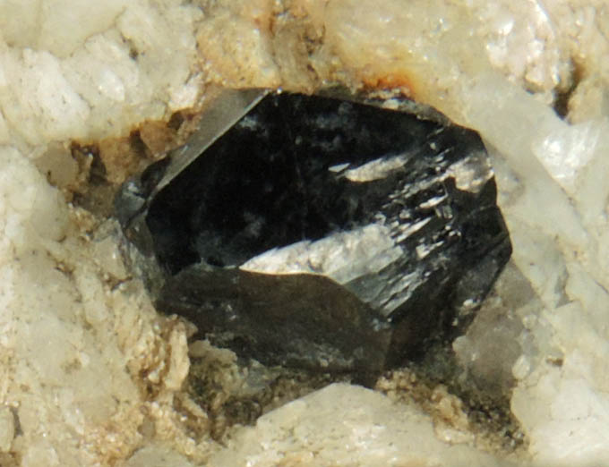 Cassiterite from Emmons Quarry, southeastern slope of Uncle Tom Mountain,  Greenwood, Oxford County, Maine