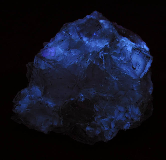 Photo below under longwave ultraviolet illumination of Fluorite from Berbes District, Asturias, Spain Fluorite from Berbes District, Asturias, Spain