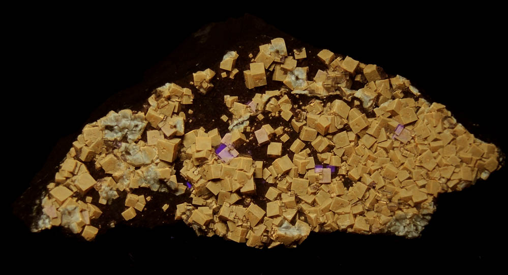 Photo below under shortwave ultraviolet illumination of Fluorite from White Rock Quarry, Clay Center, Ottawa County, Ohio Fluorite from White Rock Quarry, Clay Center, Ottawa County, Ohio