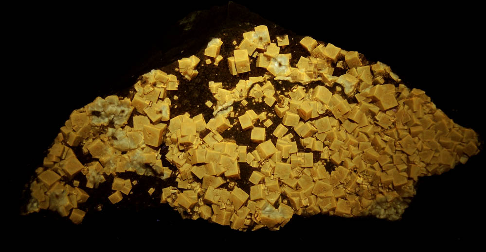 Photo below under longwave ultraviolet illumination of Fluorite from White Rock Quarry, Clay Center, Ottawa County, Ohio Fluorite from White Rock Quarry, Clay Center, Ottawa County, Ohio