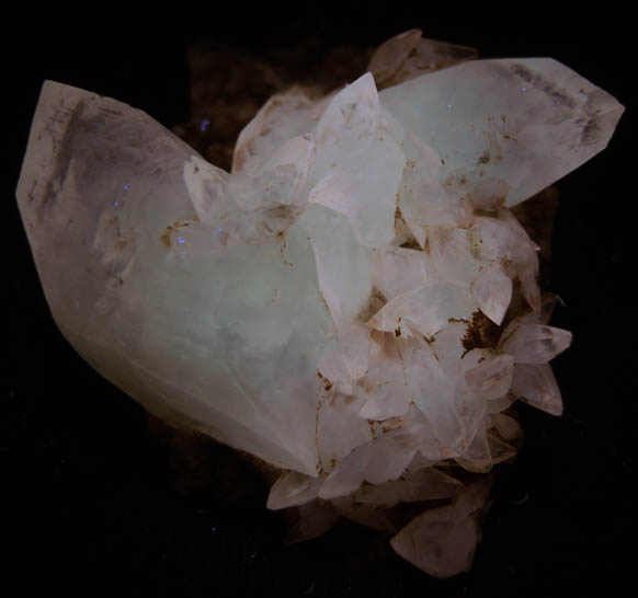 Photo below under longwave ultraviolet illumination of Calcite from Millington Quarry, Bernards Township, Somerset County, New Jersey Calcite from Millington Quarry, Bernards Township, Somerset County, New Jersey