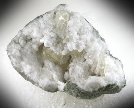 Calcite on Quartz from Hoosier Stone and Concrete Corp. Quarry, near Salem, Washington County, Indiana