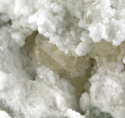 Calcite on Quartz from Hoosier Stone and Concrete Corp. Quarry, near Salem, Washington County, Indiana