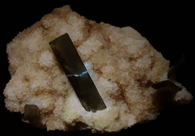 Photo below under longwave ultraviolet illumination of Barite in Calcite from Sterling Mine, Stoneham, Weld County, Colorado Barite in Calcite from Sterling Mine, Stoneham, Weld County, Colorado