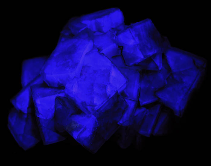 Photo below under longwave ultraviolet illumination of Fluorite over Fluorite from Okorusu Mine, 46.5 km north of Otjiwarongo, Otjozondjupa, Namibia Fluorite over Fluorite from Okorusu Mine, 46.5 km north of Otjiwarongo, Otjozondjupa, Namibia