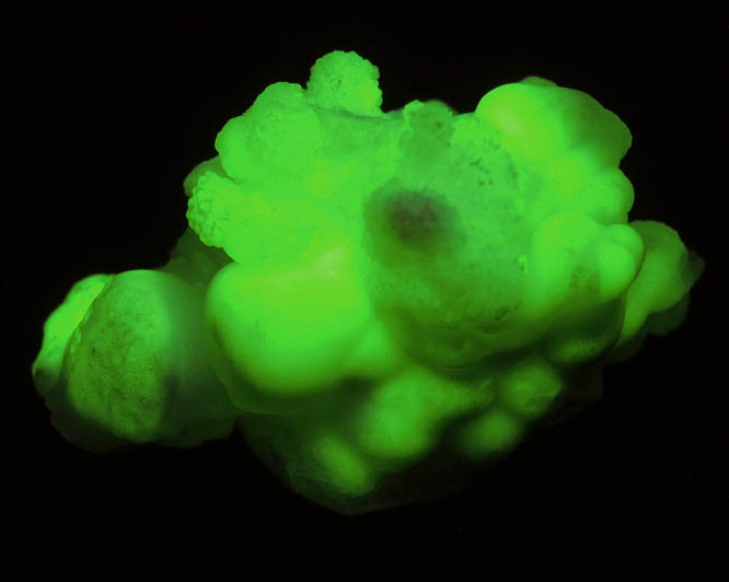 Photo below under shortwave ultraviolet illumination of Aragonite over Calcite from Mapimi, Durango, Mexico Aragonite over Calcite from Mapimi, Durango, Mexico
