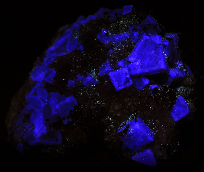 Photo below under longwave ultraviolet illumination of Fluorite, Pyrite, Quartz from Yaogangxian Mine, Nanling Mountains, Hunan, China Fluorite, Pyrite, Quartz from Yaogangxian Mine, Nanling Mountains, Hunan, China
