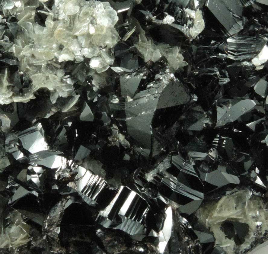 Cassiterite on Muscovite from Xuebaoding Mountain, near Pingwu, Sichuan Province, China