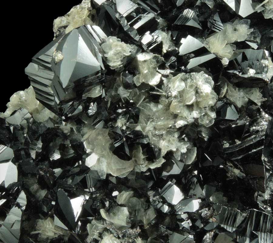 Cassiterite on Muscovite from Xuebaoding Mountain, near Pingwu, Sichuan Province, China