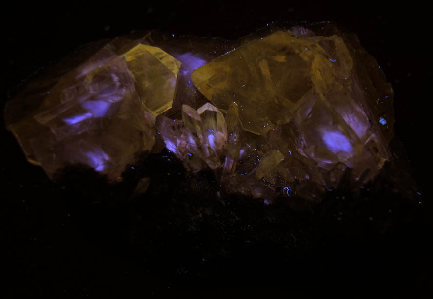 Photo below under longwave ultraviolet illumination of Anglesite in Galena from Touissit Mine, 21 km SSE of Oujda, Jerada Province, Oriental, Morocco Anglesite in Galena from Touissit Mine, 21 km SSE of Oujda, Jerada Province, Oriental, Morocco