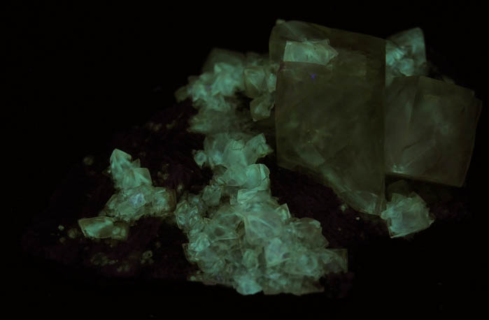 Photo below under shortwave ultraviolet illumination of Calcite from Millington Quarry, Bernards Township, Somerset County, New Jersey Calcite from Millington Quarry, Bernards Township, Somerset County, New Jersey