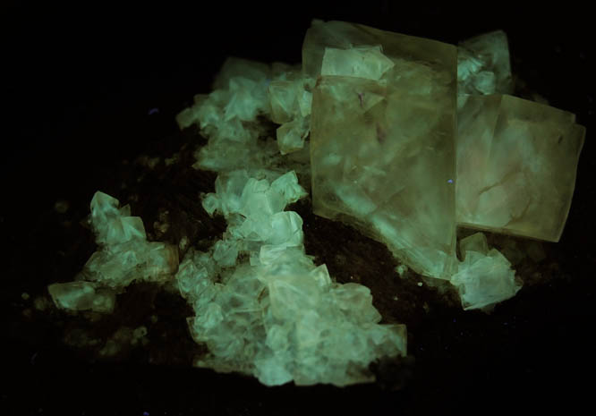 Photo below under longwave ultraviolet illumination of Calcite from Millington Quarry, Bernards Township, Somerset County, New Jersey Calcite from Millington Quarry, Bernards Township, Somerset County, New Jersey