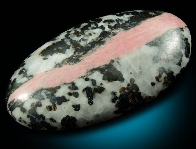 Rhodonite in Calcite-Franklinite (cabochon) from Franklin District, Sussex County, New Jersey (Type Locality for Franklinite)