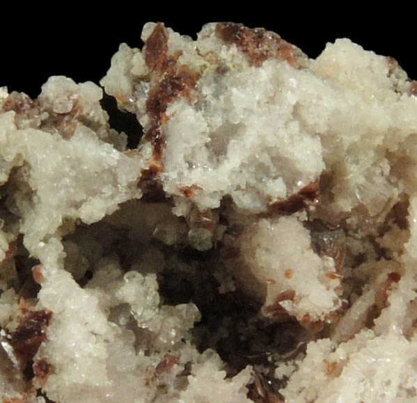 Rhodochrosite on Albite with unknown (Natrolite?) from Poudrette Quarry, Mont Saint-Hilaire, Qubec, Canada