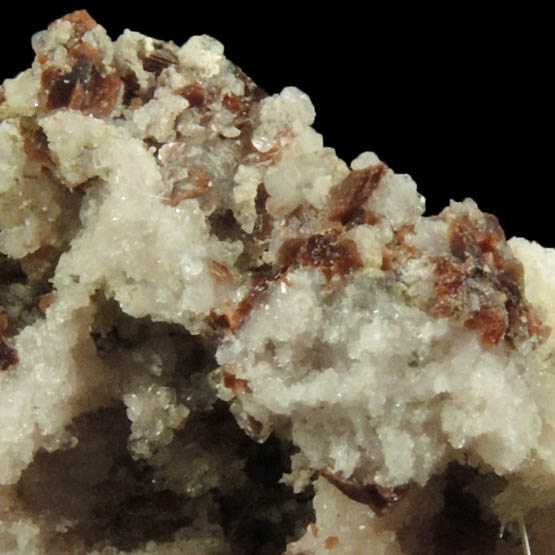 Rhodochrosite on Albite with unknown (Natrolite?) from Poudrette Quarry, Mont Saint-Hilaire, Qubec, Canada