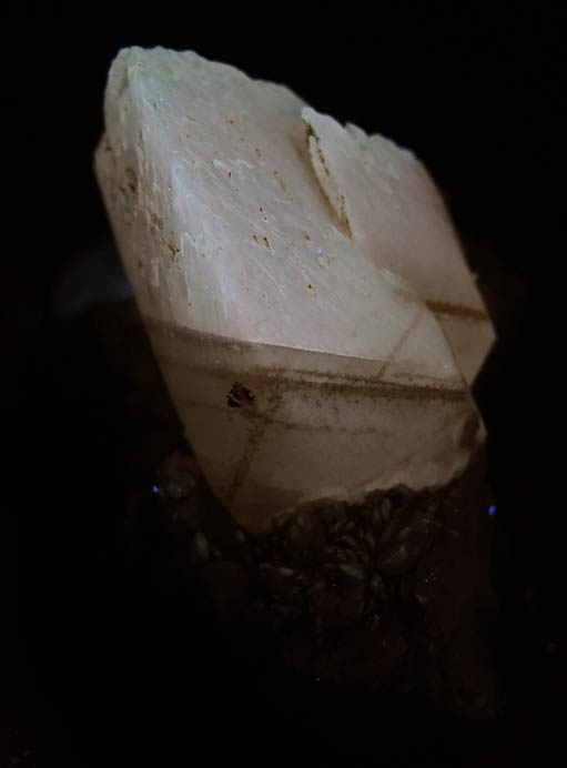 Photo below under longwave ultraviolet illumination of Calcite from Millington Quarry, Bernards Township, Somerset County, New Jersey Calcite from Millington Quarry, Bernards Township, Somerset County, New Jersey