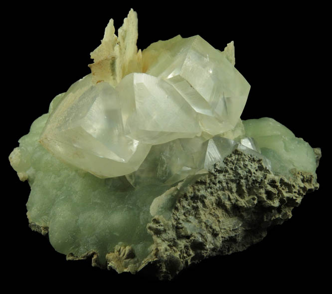 Calcite on Prehnite with pseudomorphic cavities after Calcite from Millington Quarry, Bernards Township, Somerset County, New Jersey