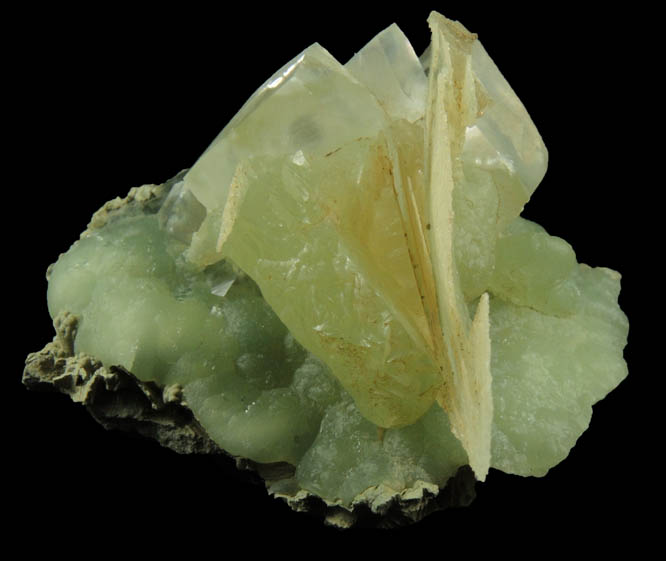 Calcite on Prehnite with pseudomorphic cavities after Calcite from Millington Quarry, Bernards Township, Somerset County, New Jersey