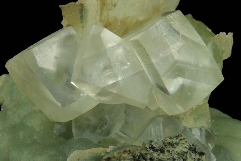 Calcite on Prehnite with pseudomorphic cavities after Calcite from Millington Quarry, Bernards Township, Somerset County, New Jersey