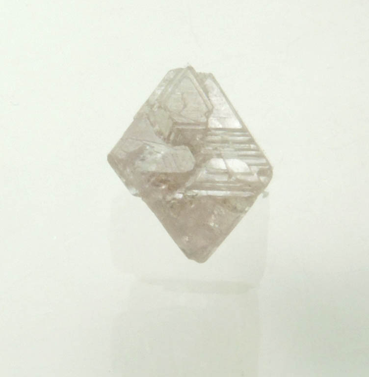 Diamond (0.70 carat pink-gray octahedral rough diamond) from Argyle Mine, Kimberley, Western Australia, Australia