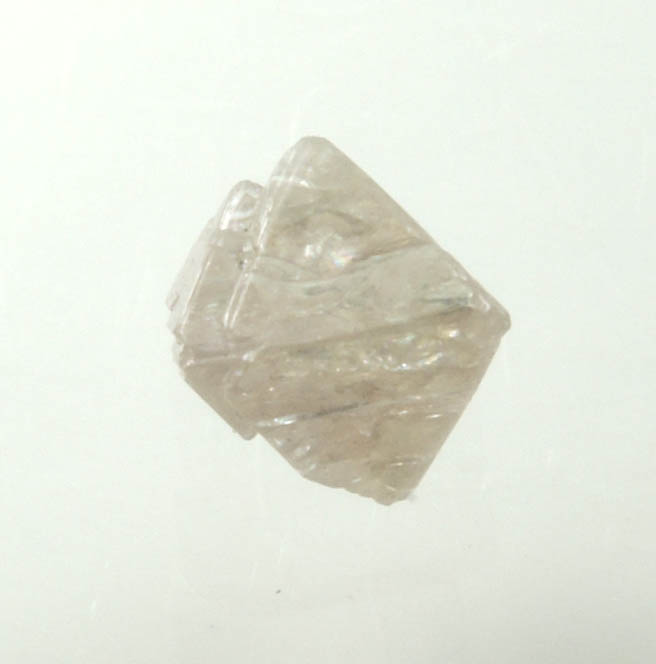 Diamond (0.70 carat pink-gray octahedral rough diamond) from Argyle Mine, Kimberley, Western Australia, Australia