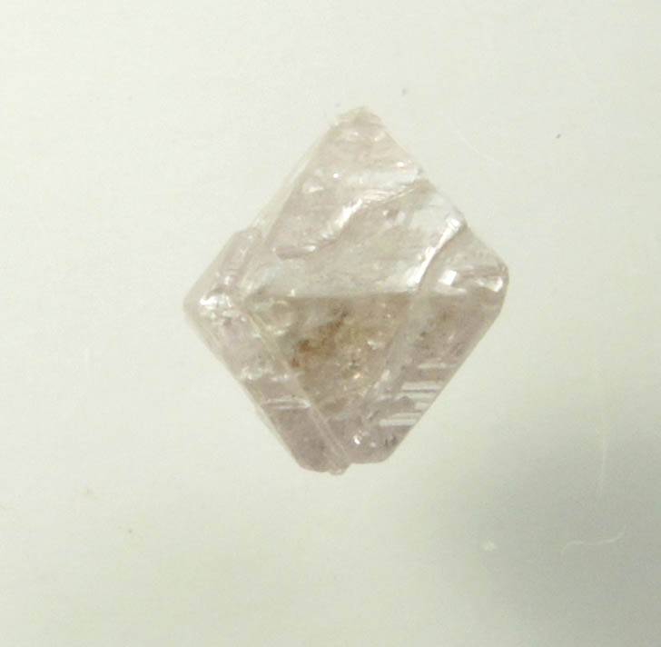 Diamond (0.70 carat pink-gray octahedral rough diamond) from Argyle Mine, Kimberley, Western Australia, Australia