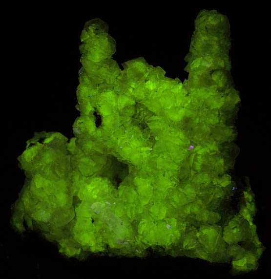 Photo below under longwave ultraviolet illumination of Adamite (stalactitic) from Mina Ojuela, Mapimi, Durango, Mexico Adamite (stalactitic) from Mina Ojuela, Mapimi, Durango, Mexico