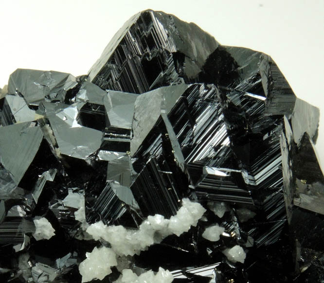 Sphalerite (Spinel Law twinned crystals) with Quartz and Calcite from Stantrg Mine, Trepca District, 7.5 km northeast of Kosozska Mitrovica, Kosovo