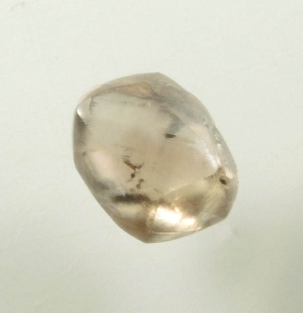 Diamond (0.67 carat brown distorted dodecahedral rough diamond) from Oranjemund District, southern coastal Namib Desert, Namibia