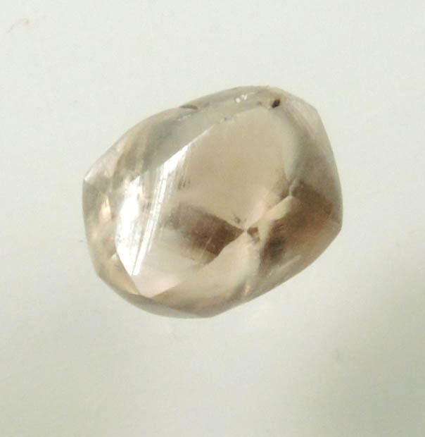 Diamond (0.67 carat brown distorted dodecahedral rough diamond) from Oranjemund District, southern coastal Namib Desert, Namibia