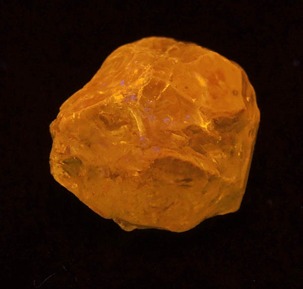 Photo below under shortwave ultraviolet illumination of Grossular var. Tsavorite Garnet from Merelani Hills, near Arusha, Tanzania Grossular var. Tsavorite Garnet from Merelani Hills, near Arusha, Tanzania