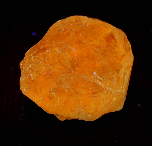 Photo below under longwave ultraviolet illumination of Grossular var. Tsavorite Garnet from Merelani Hills, near Arusha, Tanzania Grossular var. Tsavorite Garnet from Merelani Hills, near Arusha, Tanzania