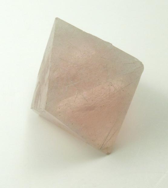 Fluorite (pink) with fibrous inclusions of actinolite-hedenbergite from Huanggang Mine, Kèshíkèténg Qí, Chifeng, China