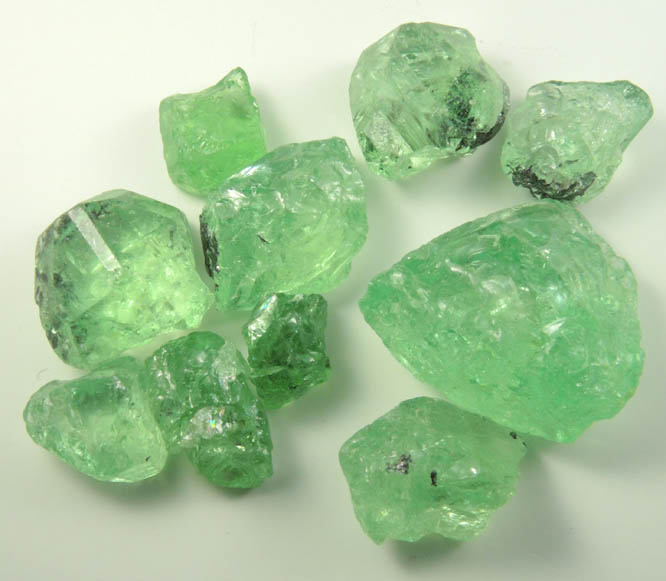 Grossular var. Tsavorite Garnet (cutting rough) from Merelani Hills, near Arusha, Tanzania