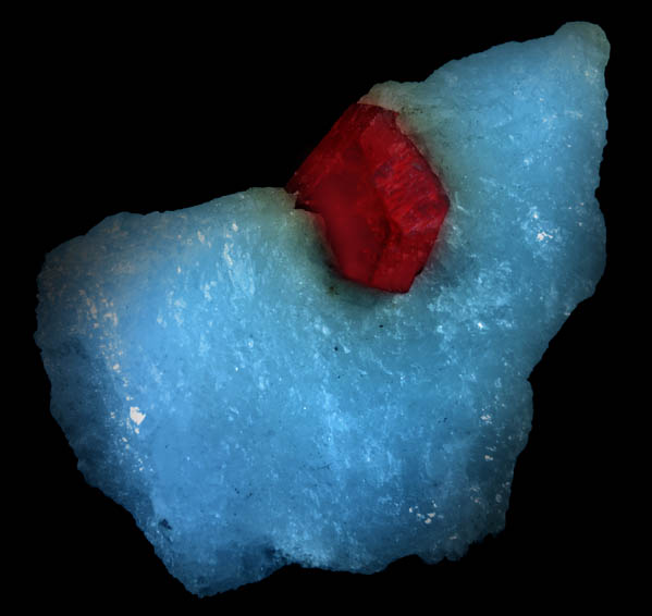 Photo below under longwave ultraviolet illumination of Spinel in marble from Mogok District, 115 km NNE of Mandalay, Mandalay Division, Myanmar (Burma) Spinel in marble from Mogok District, 115 km NNE of Mandalay, Mandalay Division, Myanmar (Burma)