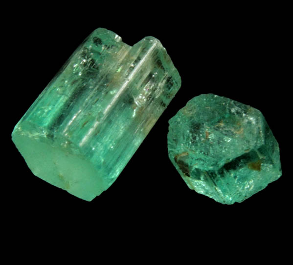 Beryl var. Emerald (two partial crystals) from Vasquez-Yacopi Mining District, Boyac Department, Colombia