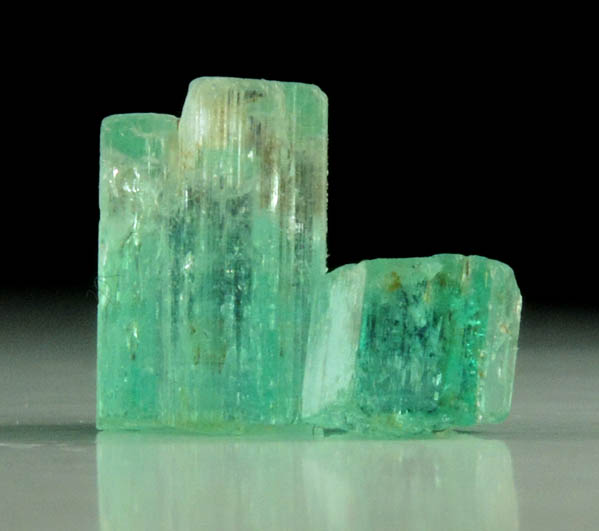 Beryl var. Emerald (two partial crystals) from Vasquez-Yacopi Mining District, Boyac Department, Colombia