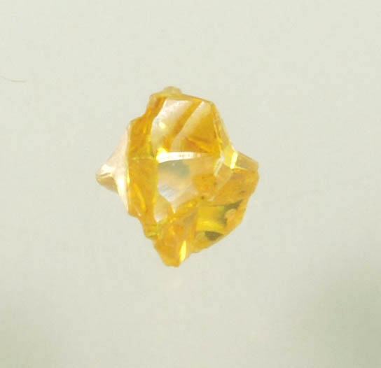 Diamond (0.14 carat fancy-yellow cubic cavernous rough diamond) from Mbuji-Mayi, 300 km east of Tshikapa, Democratic Republic of the Congo