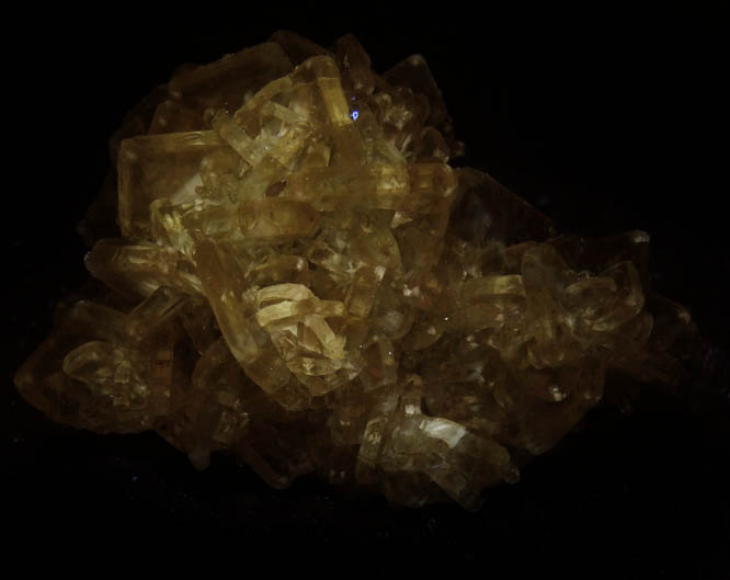 Photo below under longwave ultraviolet illumination of Barite with Calcite from Meikle Mine, Elko County, Nevada Barite with Calcite from Meikle Mine, Elko County, Nevada