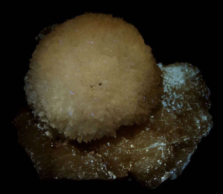 Photo below under longwave ultraviolet illumination of Mesolite on Stilbite from Kannad, Aurangabad, Maharashtra, India Mesolite on Stilbite from Kannad, Aurangabad, Maharashtra, India