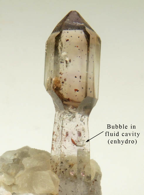 Quartz (Scepter Formation) with Hematite inclusions and bubble in fluid-filled cavity (Enhydro) from Goboboseb Mountains, 43 km west of Brandberg Mountain, Erongo region, Namibia