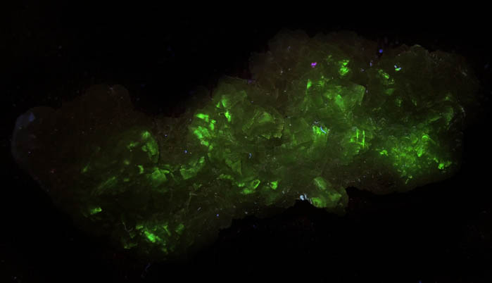 Photo below under longwave ultraviolet illumination of Prehnite with Quartz from Krimmler Achental, Hohe Tauern, Salzburg, Austria Prehnite with Quartz from Krimmler Achental, Hohe Tauern, Salzburg, Austria