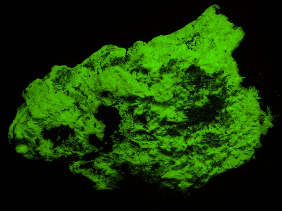 Photo below under shortwave ultraviolet illumination of Willemite (fibrous) from Franklin Mine, Sussex County, New Jersey Willemite (fibrous) from Franklin Mine, Sussex County, New Jersey