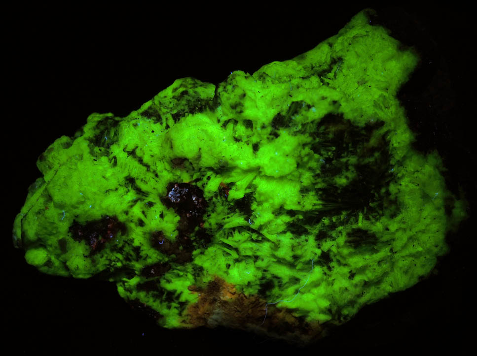 Photo below under longwave ultraviolet illumination of Willemite (fibrous) from Franklin Mine, Sussex County, New Jersey Willemite (fibrous) from Franklin Mine, Sussex County, New Jersey