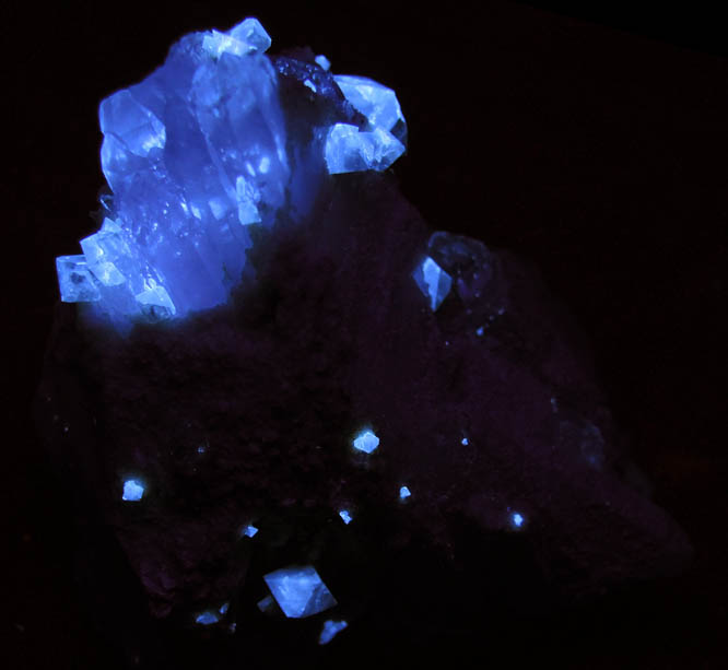 Photo below under shortwave ultraviolet illumination of Scheelite on Quartz from Yaogangxian Mine, Nanling Mountains, Hunan, China Scheelite on Quartz from Yaogangxian Mine, Nanling Mountains, Hunan, China