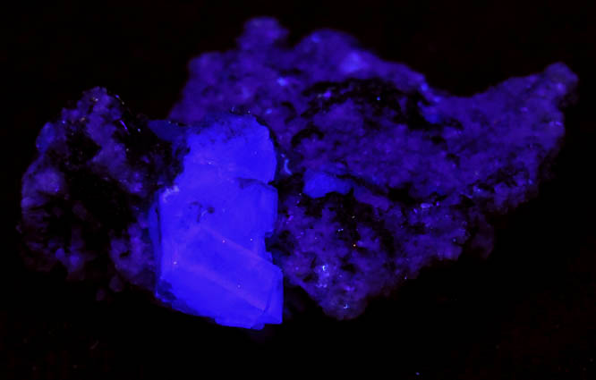 Photo below under shortwave ultraviolet illumination of Fluorite on Calcite from Old Mine Plaza, Trumbull, Fairfield County, Connecticut Fluorite on Calcite from Old Mine Plaza, Trumbull, Fairfield County, Connecticut