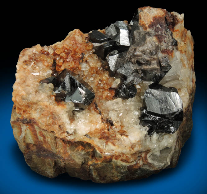 Cassiterite (twinned crystals) on Topaz from St. Agnes District, Cornwall, England