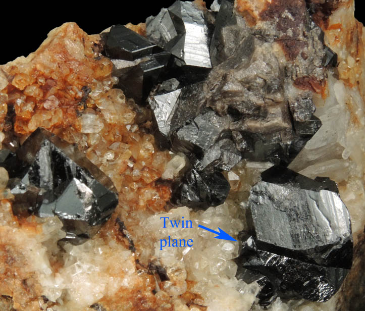 Cassiterite (twinned crystals) on Topaz from St. Agnes District, Cornwall, England